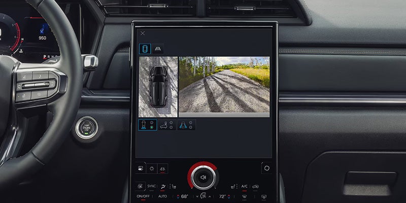 The image shows a car dashboard with a 360-degree camera view on the touchscreen.