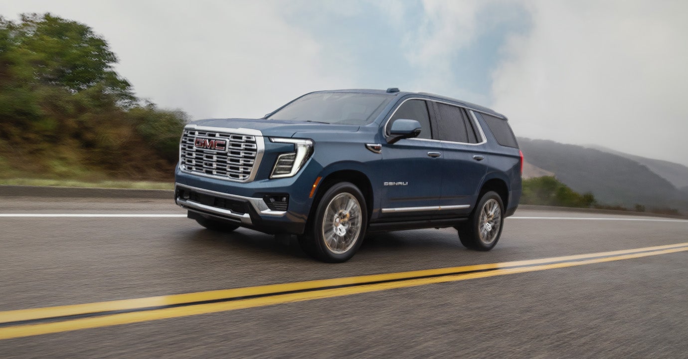 2026 GMC Yukon with sleek exterior design in a scenic setting.